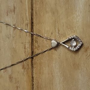 Sterling silver necklace.  20" with floating cubic zirconia.